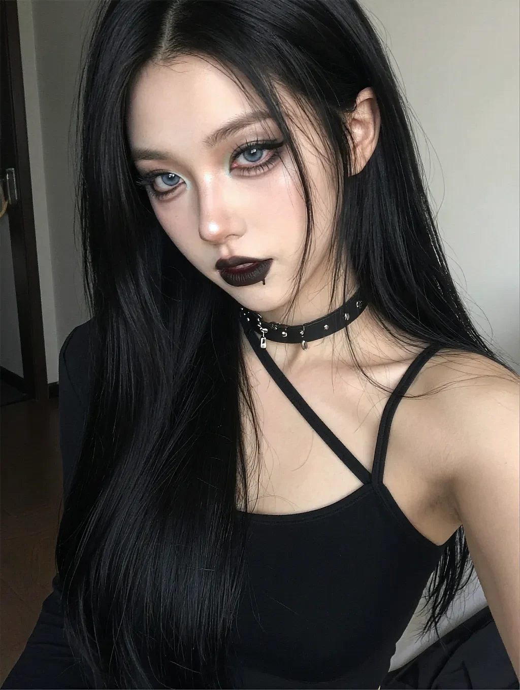 Fictional AI character with long black hair in a black halter top, washed in pink neon